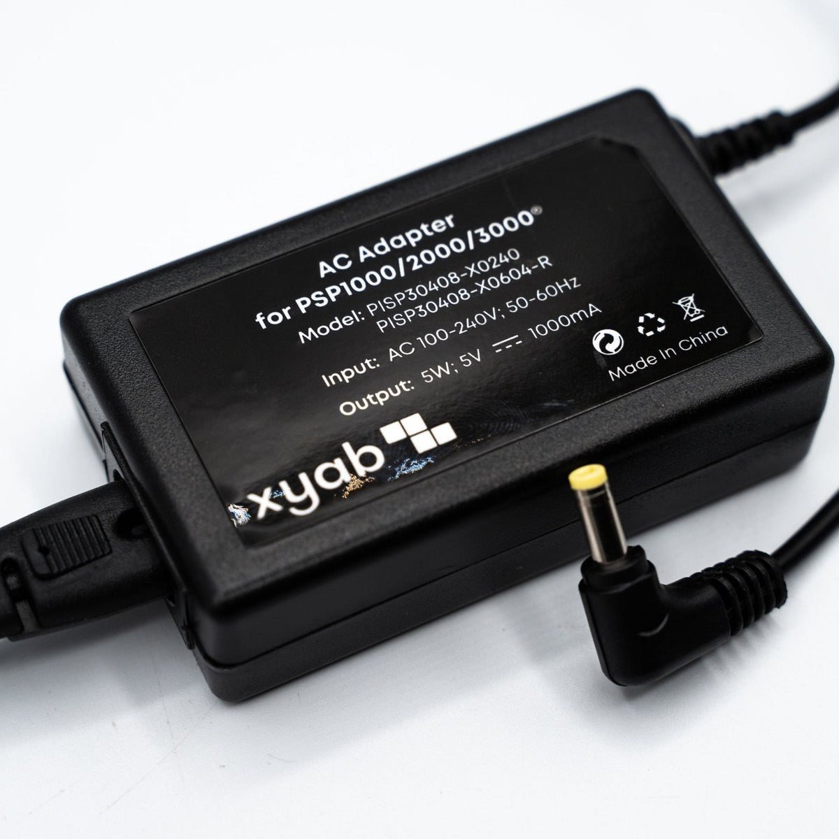 PSP charger adapter front view with US two prong plug